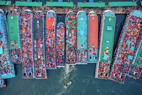 Aerial view of people onboard of a passenger ship along Buriganga river, Keraniganj, Dhaka, Bangladesh. - AAEF15083