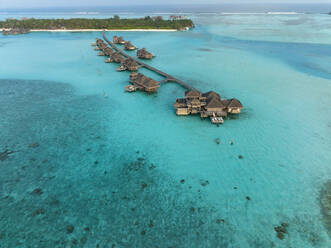 Maldives, North Male Atoll, Lankanfushi, Aerial view of bungalows of tropical tourist resort - AMF09562