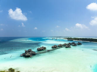 Maldives, North Male Atoll, Lankanfushi, Aerial view of bungalows of tropical tourist resort - AMF09564