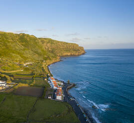 Aerial View of landscape of the coast and the village on the cliff, Praia Formosa, Almagreira, Azores, Portugal. - AAEF15227