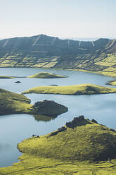 View of mountains and lake on sunny day at Corvo Island, Azores, Portugal - FVSF00460