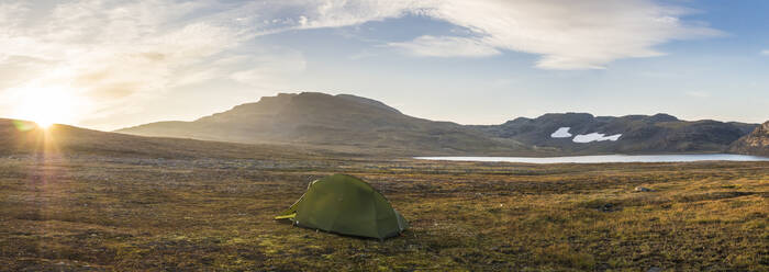 Norway, Lone tent pitched on plateau in Hardangervidda National Park at sunrise - HUSF00265