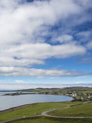 UK, Scotland, Clouds over coastal village in Northwest Highlands - HUSF00297