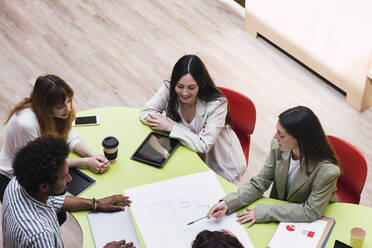 Business team having a meeting at table in conference room - PNAF04407