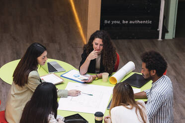 Business team having a meeting at table in conference room - PNAF04408