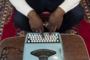 Hands of businessman typing on vintage typewriter - WESTF25029