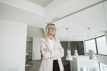 Businesswoman in modern office wearing glasses - EBBF06148