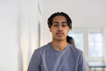 Portrait of teenage boy standing by wall - MASF31849