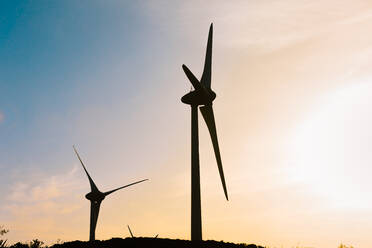 From below wind generators and amazing heaven sky at sunset - ADSF36723