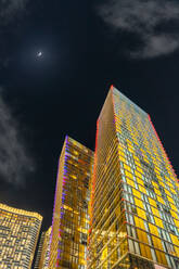 Low angle view of illuminated modern skyscrapers in Las Vegas at night - ADSF36804