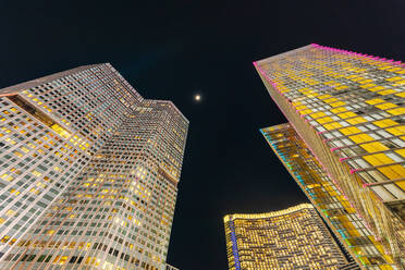 Low angle view of illuminated modern skyscrapers in Las Vegas at night - ADSF36809