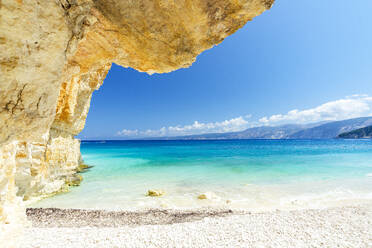 Crystal sea surrounded by limestone cliffs and white pebbles, Fteri Beach, Kefalonia, Ionian Islands, Greek Islands, Greece, Europe - RHPLF22856