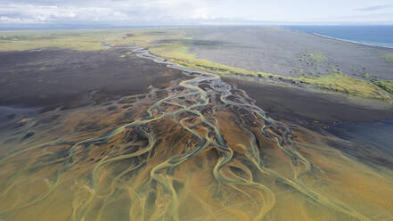 Aerial view of a water abstract pattern from a river estuary in Iceland. - AAEF15566