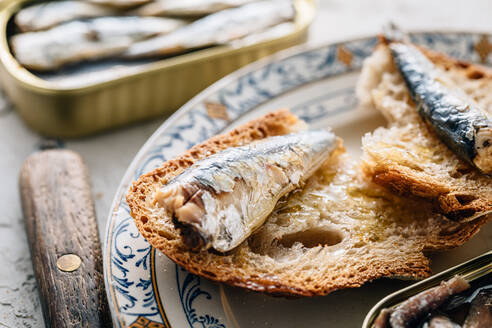 Top view of delicious plate of bread with sardines - ADSF36942