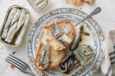 Top view of delicious plate of bread with sardines - ADSF36944