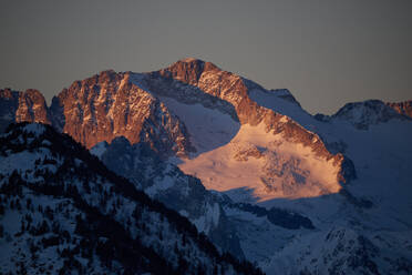 Hillside covered with snow in Pyrenees mountains located in Spanish Vall dAran under cloudless sunset sky - ADSF37648