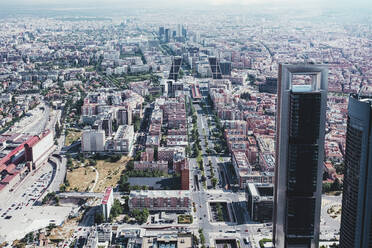 From above aerial drone view shot of city with dense infrastructure in Madrid, Spain - ADSF37907