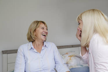 Cheerful mother and daughter spending time together at home - IHF01293