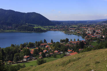 Germany, Bavaria, Schliersee, View of lake Schliersee and surrounding town in summer - JTF02210