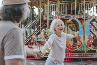 Happy couple enjoying together at amusement park - YTF00025