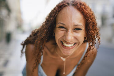 Cheerful young woman with curly hair - DCRF01392