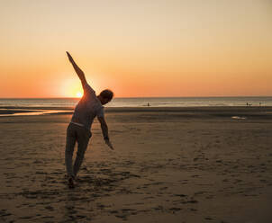 Mature man having fun at beach - UUF27280