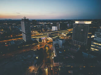 Aerial view of buildings in Essen under sky at dusk - JOSEF13271