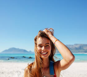 Square portrait of charming young woman on the beach. Beautiful young caucasian female model on the seashore. - JLPPF00121