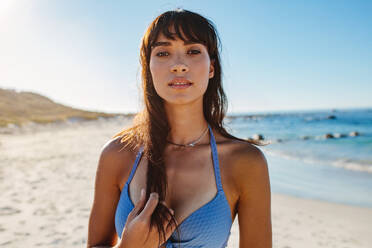 Portrait of attractive young woman on the beach. Sensual caucasian female model posing on the seashore. - JLPPF00190