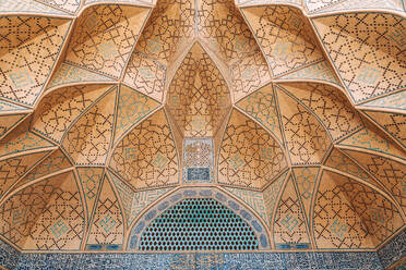 Low angle of detail of Jameh Mosque of Isfahan with geometric wall and ceiling with decorative mosaic - ADSF38807