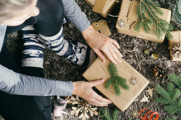 Woman wrapping a christmas present - ADSF39008