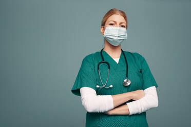 Caucasian nurse wearing stethoscope in hospital stock photo