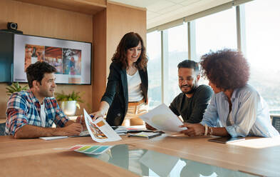 Group of young business people meeting in conference room. Team of creative professionals discussing new project. - JLPSF00568