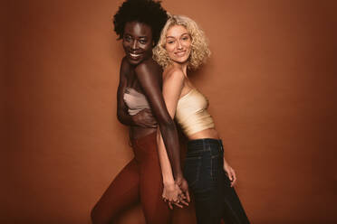 Two Young Attractive Women Smiling. Two Lovely Woman In Jeans And Bra by  Stocksy Contributor Screen Moment - Stocksy