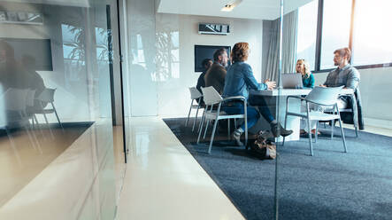 Group of business people having discussion in conference room. Creative business team brainstorming over new project. - JLPSF02517