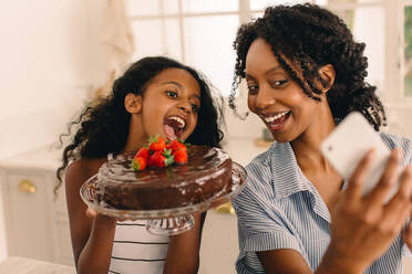 little girl eating cake