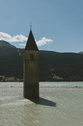 Italy, Trentino-Alto Adige, Bell tower submerged in Lake Reschen - DMGF00852