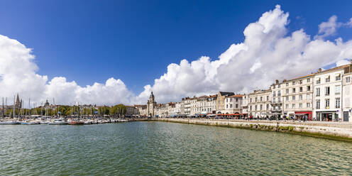 France, Nouvelle-Aquitaine, La Rochelle, Panoramic view of promenade stretching along city harbor - WDF07050