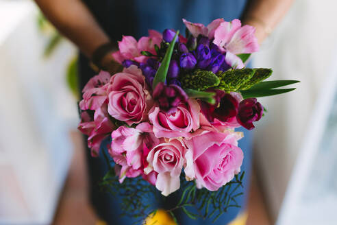 Close up of flowers in hands of florist. Colorful and fresh flower bouquet. - JLPSF05091