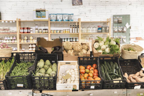 Fresh vegetables arranged in crates at greengrocer shop - PCLF00130