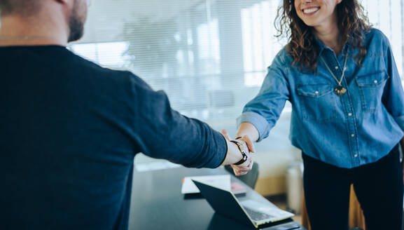 Cropped shot of a two businesspeople handshake after successful meeting. Businesswoman shaking hands with job candidate. - JLPSF05310