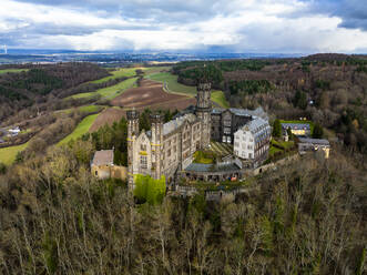 Germany, Rhineland-Palatinate, Balduinstein, Aerial view of Schaumburg Castle in autumn - AMF09604