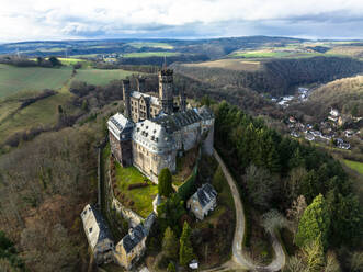 Germany, Rhineland-Palatinate, Balduinstein, Aerial view of Schaumburg Castle in autumn - AMF09607