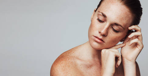 Close up of woman with freckles on body. Portrait of woman showing her beautiful freckles. - JLPSF06122