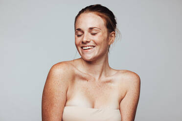 Portrait of a happy woman. Close up of woman with freckles on body in cheerful mood. - JLPSF06123