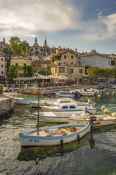 View of boats in the marina and harbourside restaurants during golden hour in Volosko, Opatija, Kvarner Bay, Croatia, Europe - RHPLF23174