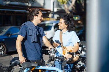 Smiling couple at bicycle parking station - JOSEF14477