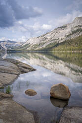Mountain reflections in the tranquil waters of Tenaya Lake in Yosemite National Park, UNESCO World Heritage Site, California, United States of America, North America - RHPLF23220