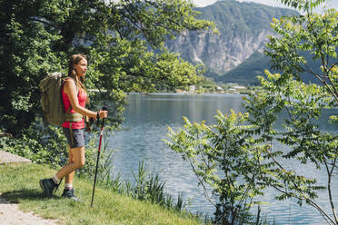 Hiker admiring nature standing near Lake Levico - GIOF15562