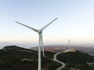 Greece, Aegean, Kos, Wind farm turbines at dawn - CVF02183